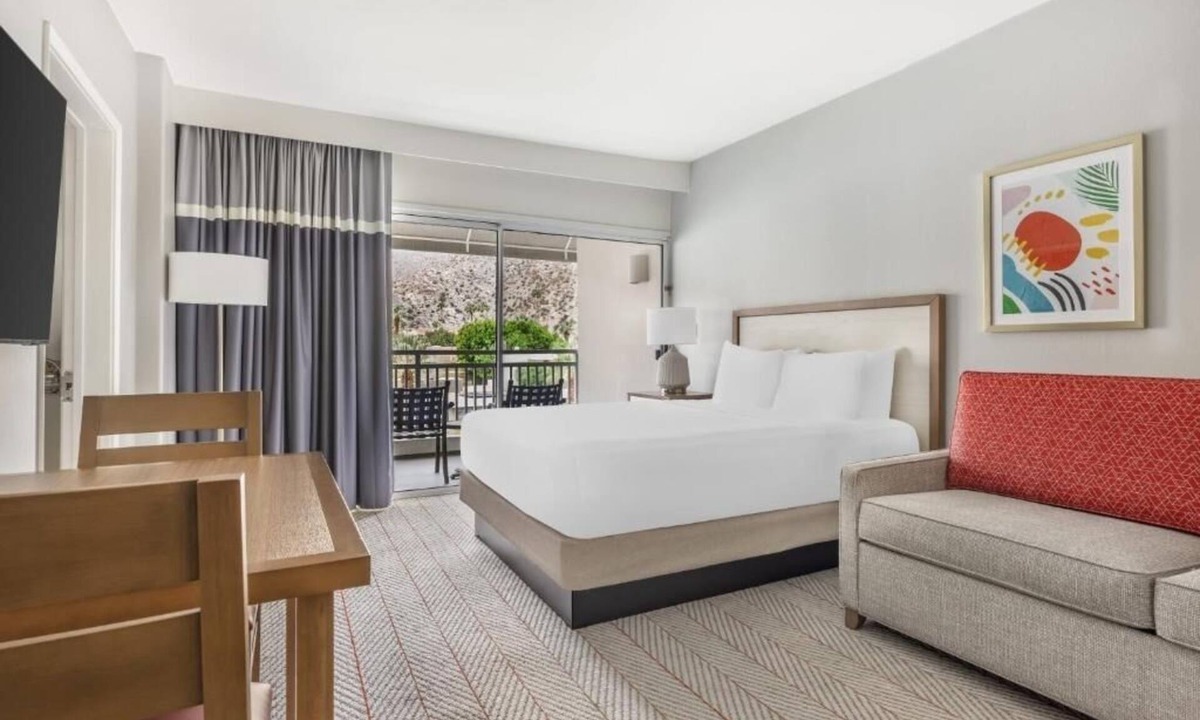Canyon Corridor Hotel | Modern Suite with Private Balcony and Gorgeous Pool Views for Relaxation