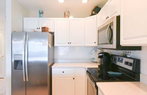 Heron Harbour Isle Condo | 3 Bedroom 2 Bath Condo Canal view with Pool, WiFi, Full Kitchen