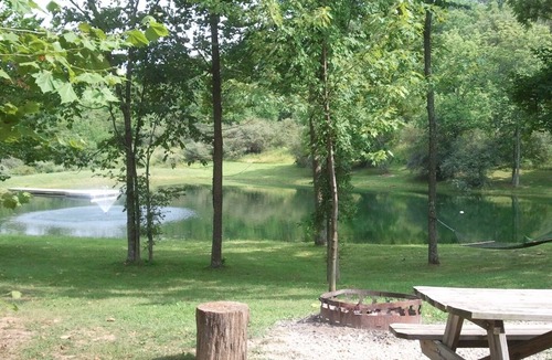 Blue Rock Cabin | Beautiful Secluded Deluxe Log Cabin Overlooking Stocked Pond