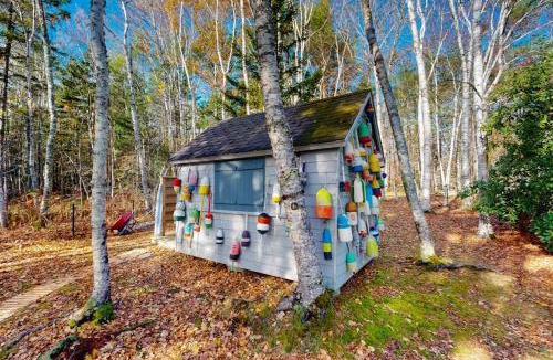 Wiscasset House | Charming riverfront home with cozy interiors, dock, and scenic deck views
