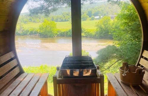 Johnson House | Designer A-Frame Treehouse with hot tub on river