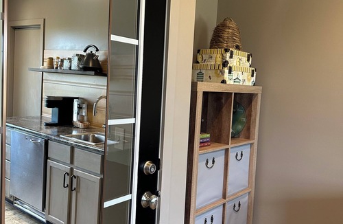 Sugarcreek Apartment | Great bedroom with private bathroom & Lounge above a local Diner