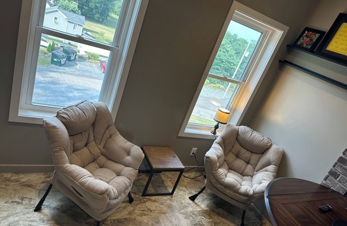 Sugarcreek Apartment | Great bedroom with private bathroom & Lounge above a local Diner