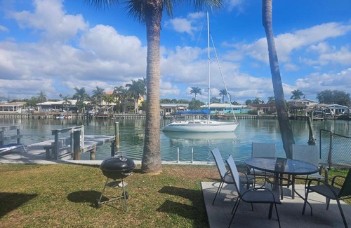 Capri Isle Apartment | Oasis Waterfront Treasure Island Condo with Patio Dock and Johns Pass