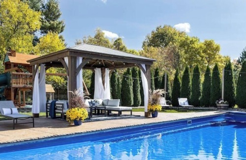 Northwest Columbus House | Pool, Oasis, Outdoor fire, 2 King bed suites, Theater, Workout room, Playground