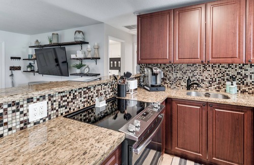 Hunt Club House | Relax & Recharge: Saltwater Pool + Lush Backyard Oasis in Palm Beach Gardens