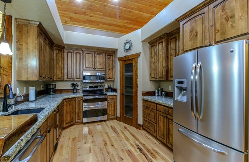 Tamarack Resort Cabin | REMOTE CABIN WITH HOT TUB, MOVIE THEATER AND HUGE COVERED DECK WITH FIRE TABLE