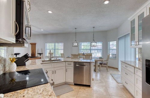 Palm Harbor House | Riverfront, Pool, Dock, Pool Table, River