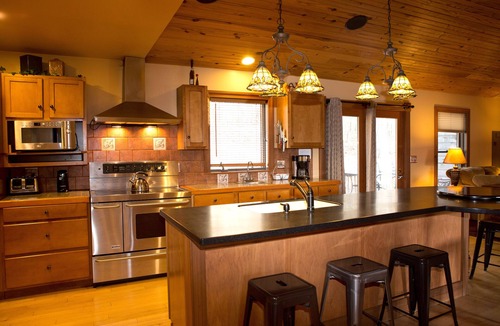Logan Cabin | The Lodge at Harvest Moon sleeps 16 with five bedrooms and unique private Pub