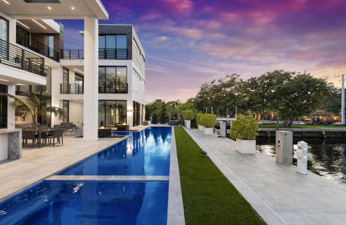 Coral Ridge House | Three Story Waterfront Villa with Basketball and Mini Golf