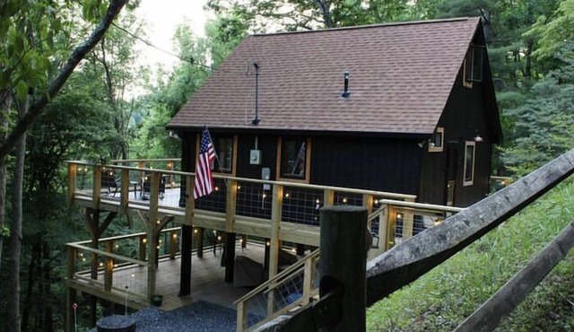 Cabin in the Blue Ridge Mountains, nestled in the tree tops overlooking a creek