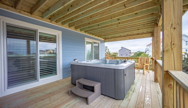 Grand beach home with elevator, private hot tub, game room, & pool access