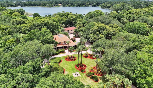 Lakefront Estate on 5 acres with Pavilion. Absolutely stunning.