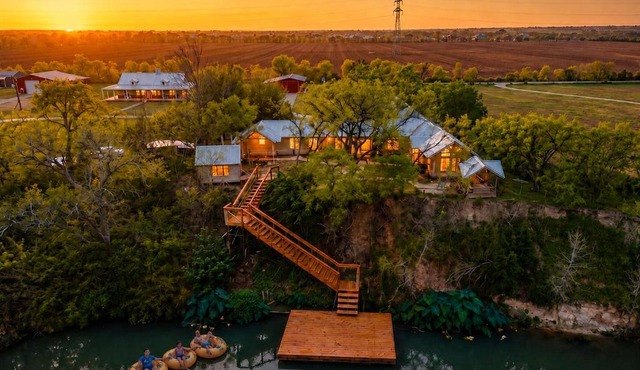 Private Riverfront Estate with Dock, Pool, Hot Tub, and Gym
