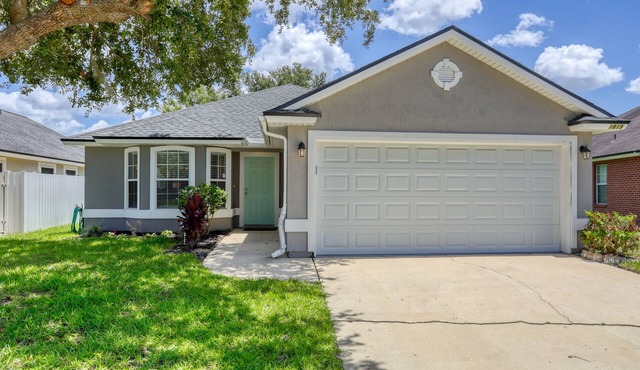 Single-story home with lagoon view, garden patio & easy drive to the beach